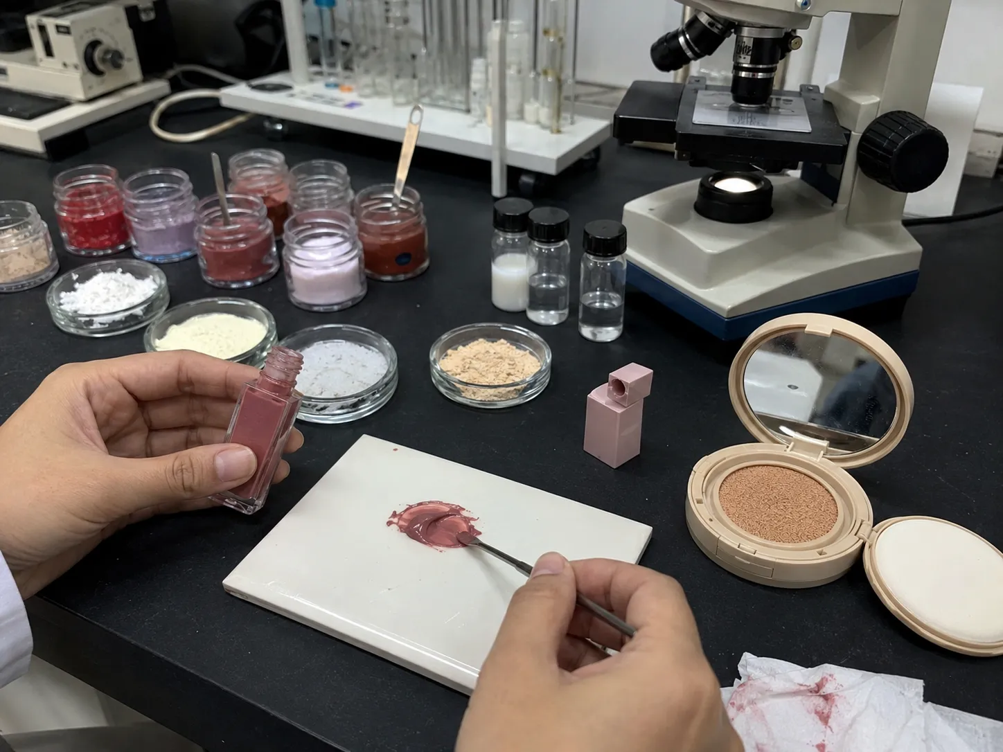 Matte lip glaze and cushion foundation formulation analysis in a cosmetics laboratory